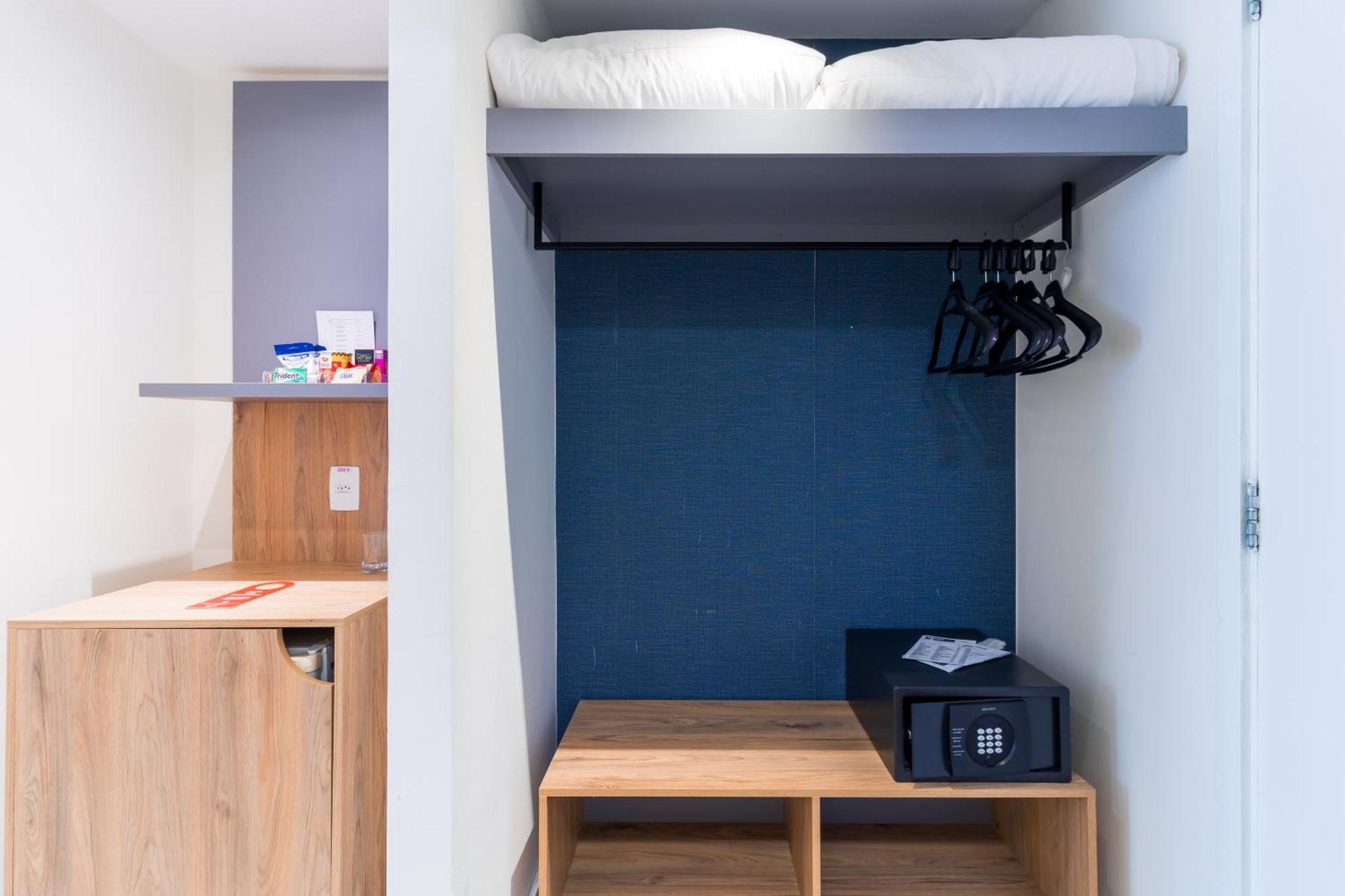 Parque Balneario Hotel Santos By Castelo Itaipava Cameră foto A typical bedroom in the new halls of residence